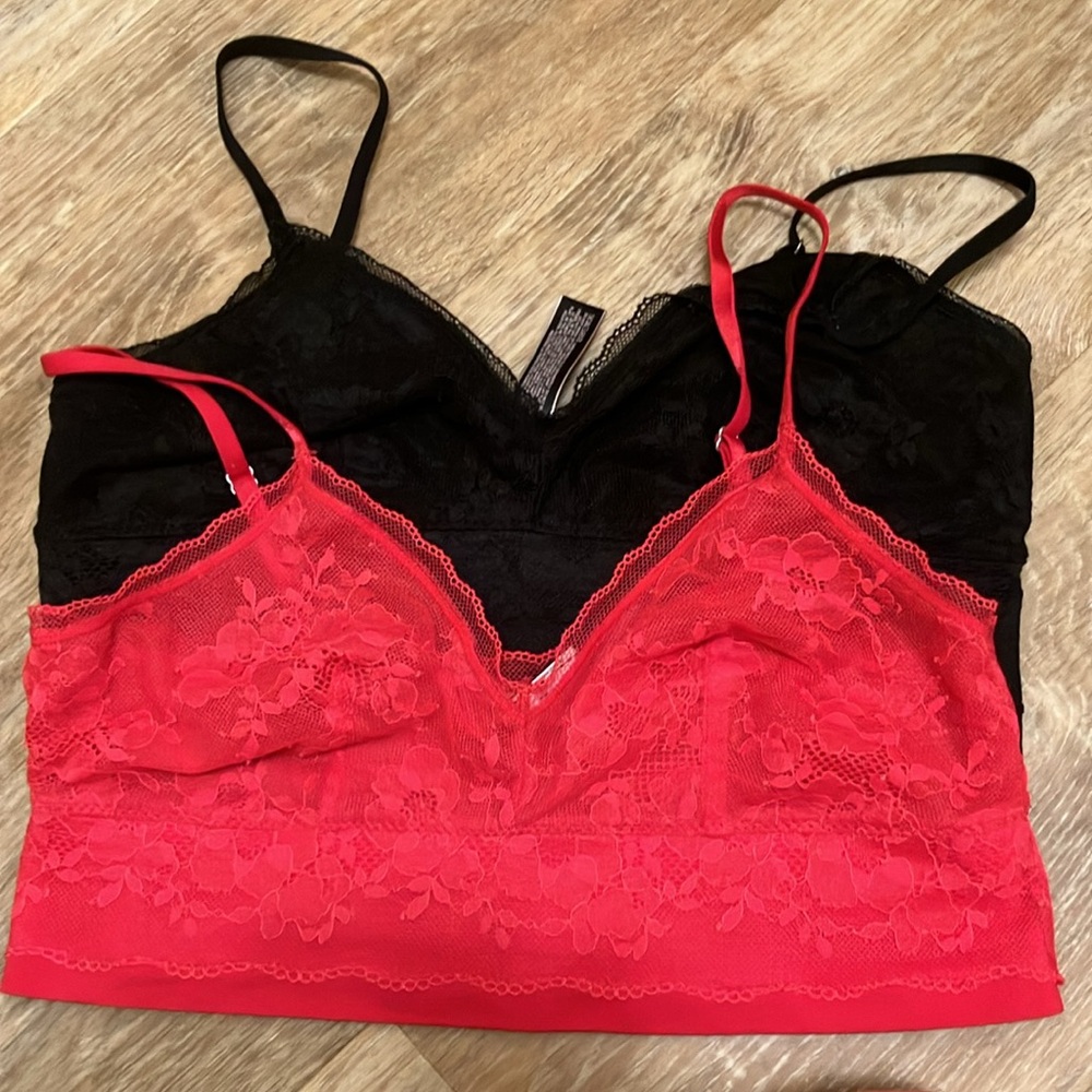 Set of 2 bralettes, one red, one black.